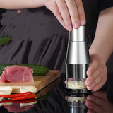 Manual garlic press chopper with fresh garlic cloves