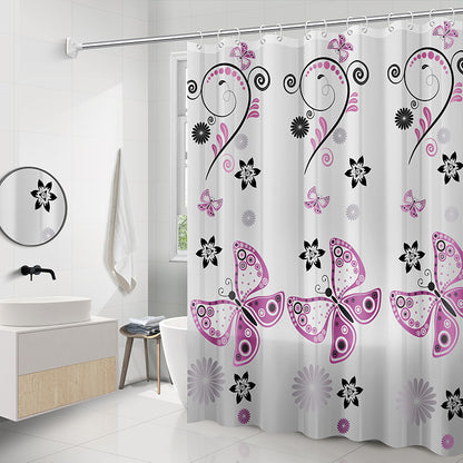 Geometric PEVA shower curtain being wiped clean with a damp cloth while hanging on rod
