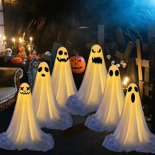 Ghost Halloween decoration group with yellow light and pumpkin front porch display