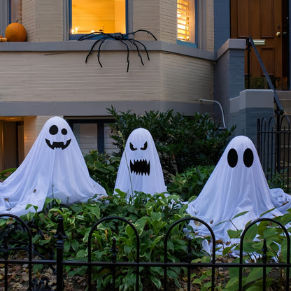 White cloth ghost Halloween decoration outdoor garden daytime display