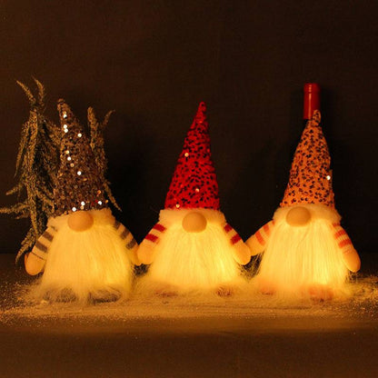 Glowing faceless gnome doll with warm light