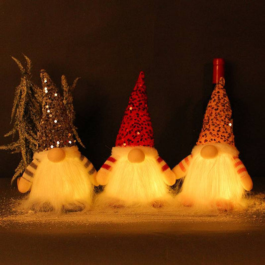 Glowing faceless gnome doll with warm light