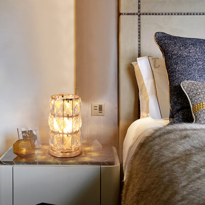 Gold crystal table lamp in bedroom setting

