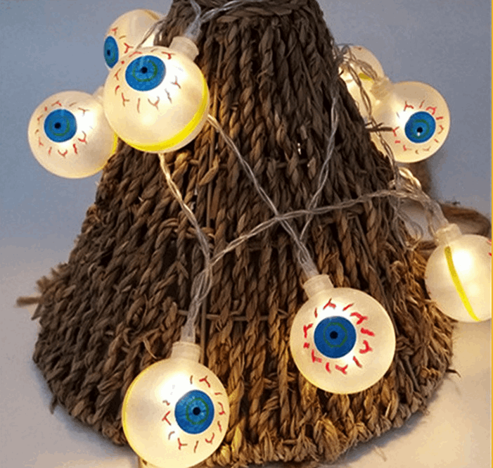 Halloween pumpkin string lights on tree branches