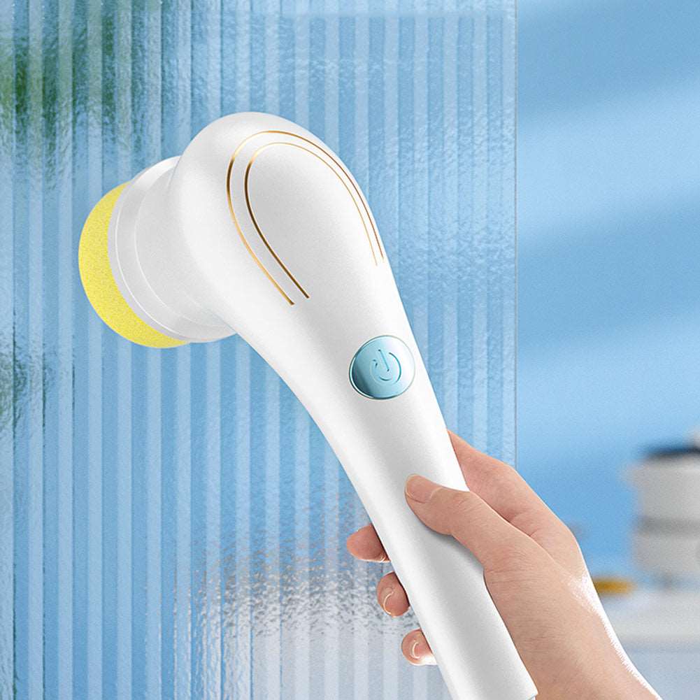 White handheld dishwashing scrubber brush close up