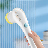 White handheld dishwashing scrubber brush close up