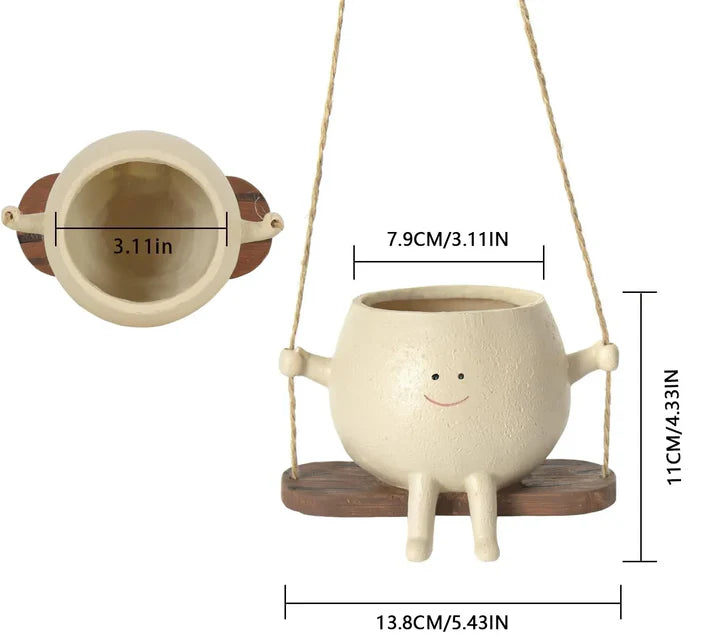 Hanging face planter with swing head flower pot design