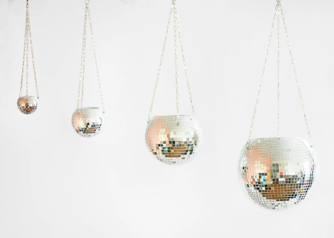 Multiple sizes of hanging mirror ball flowerpots displayed together