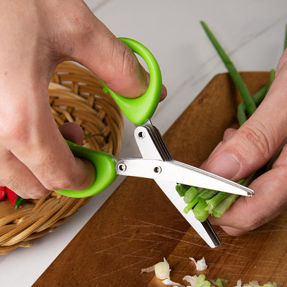 Multi layer herb cutting scissors cutting green onion on board