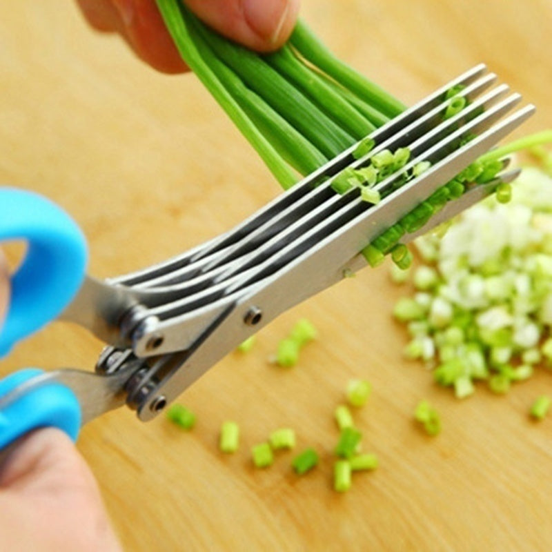 Stainless steel herb cutting scissors in use kitchen prep display