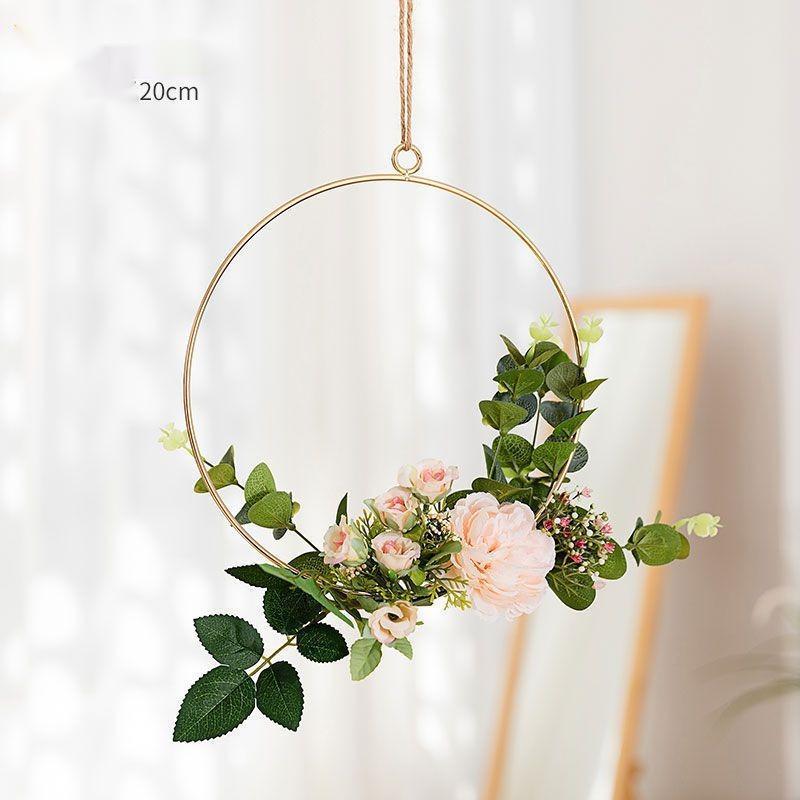 Iron flower wall hanging as a soft accent piece on a modern neutral living room wall
