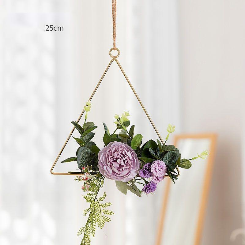 Handmade iron and flower wall art in a romantic styled bedroom with warm lighting
