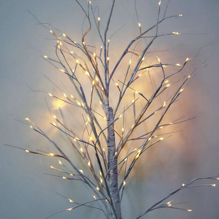 LED birch tree lights decorating bedroom corner
