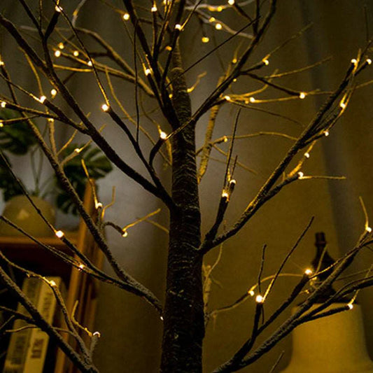 Warm ambient glow from LED birch tree lights at night
