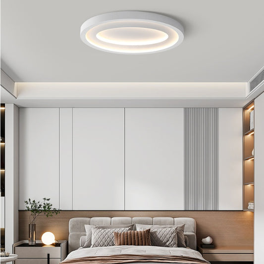 Nordic LED ceiling light installed in a master bedroom with soft even white illumination
