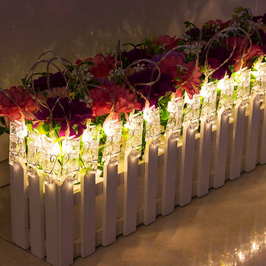 LED photo holder string lights used as room decor setup

