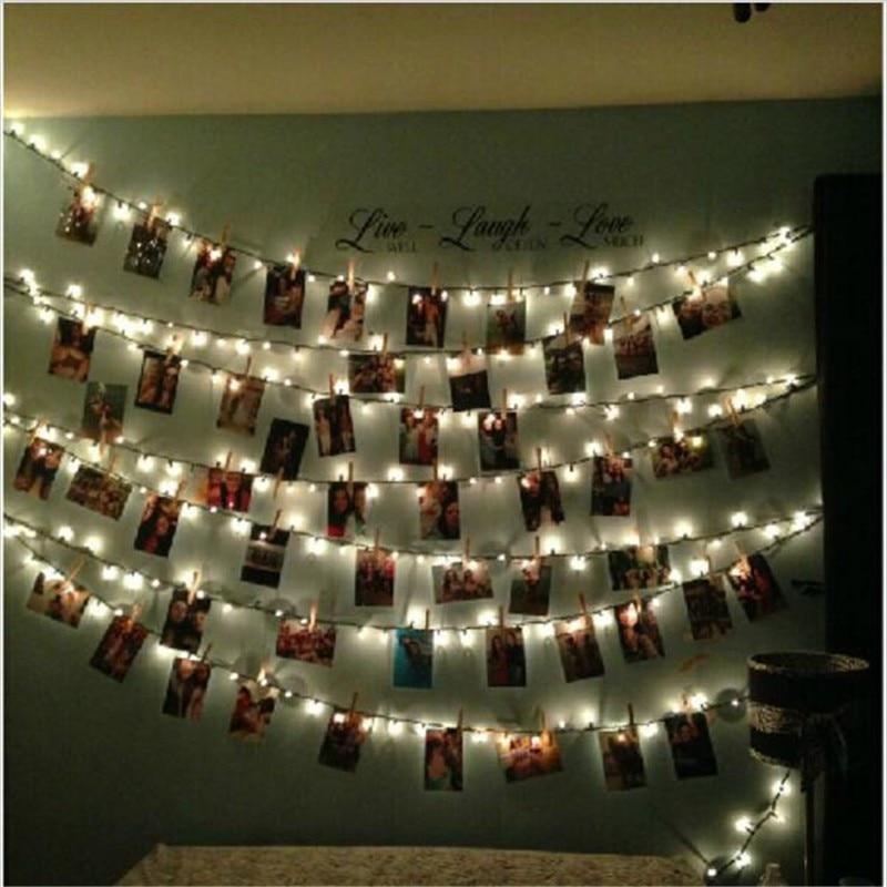 Warm white LED photo holder string lights glowing softly
