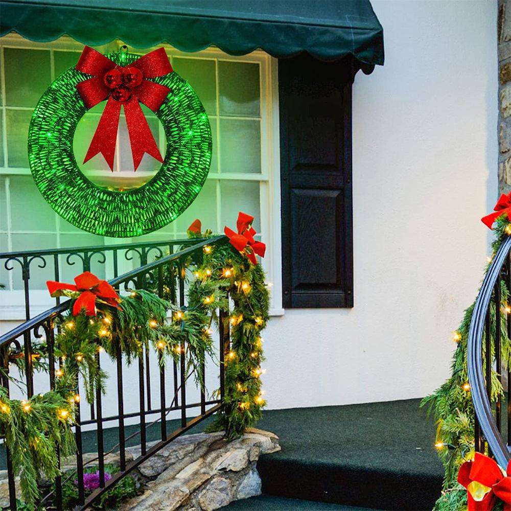 LED Christmas wreath glowing at nighttime