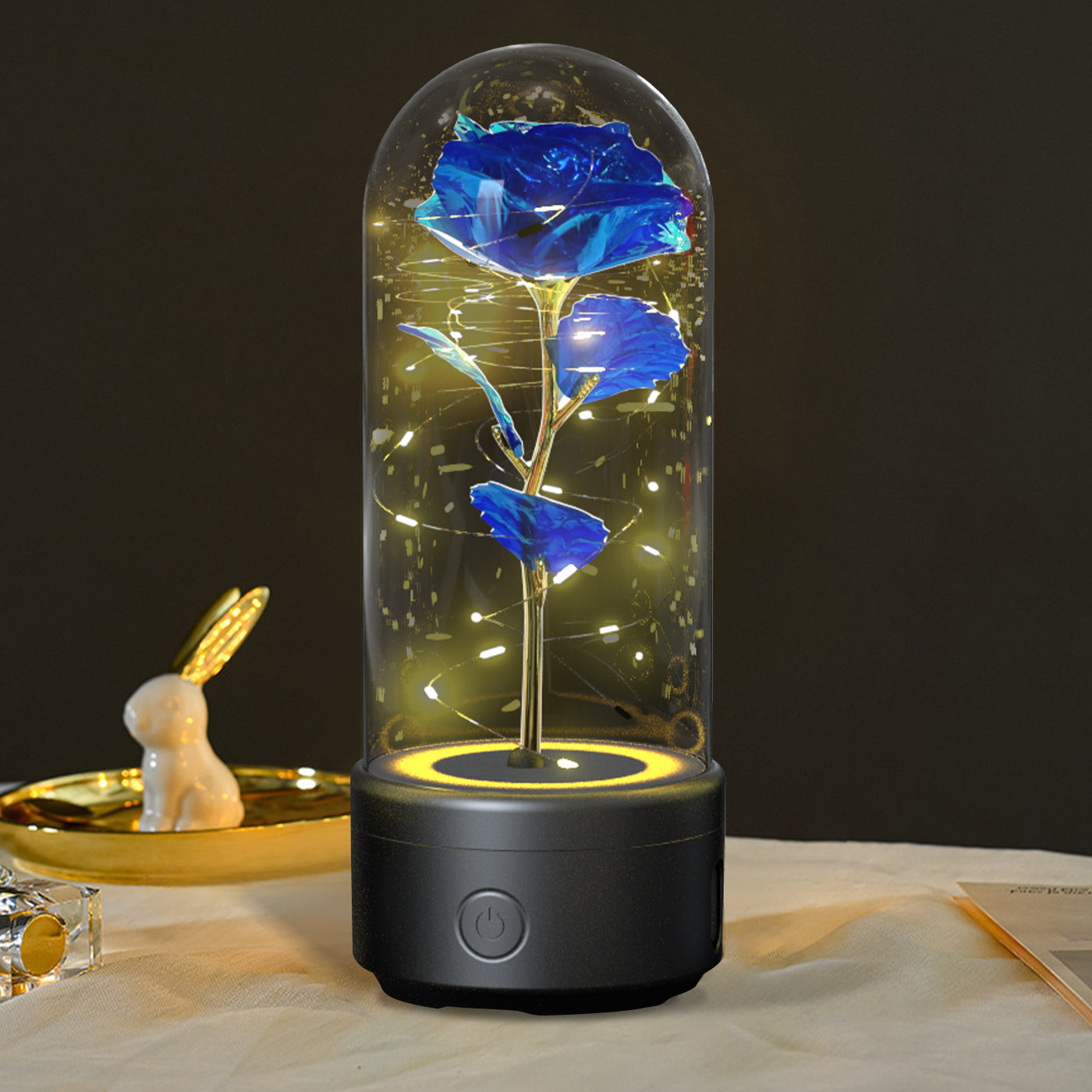 Luminous rose night light with blue flower in glass dome