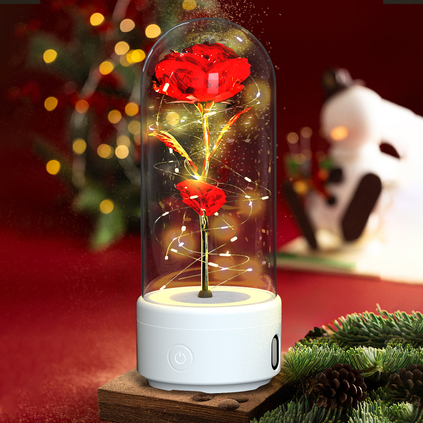 Luminous rose night light with white base and glowing flower