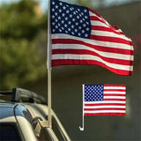 American flag mounted on car window showing full display