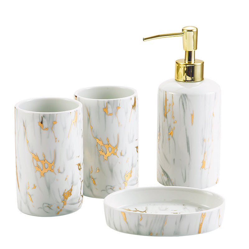 Complete white marble bathroom accessories set displayed