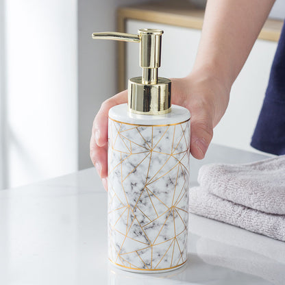 Close-up of the marble pattern and smooth glaze finish on the ceramic soap bottle surface
