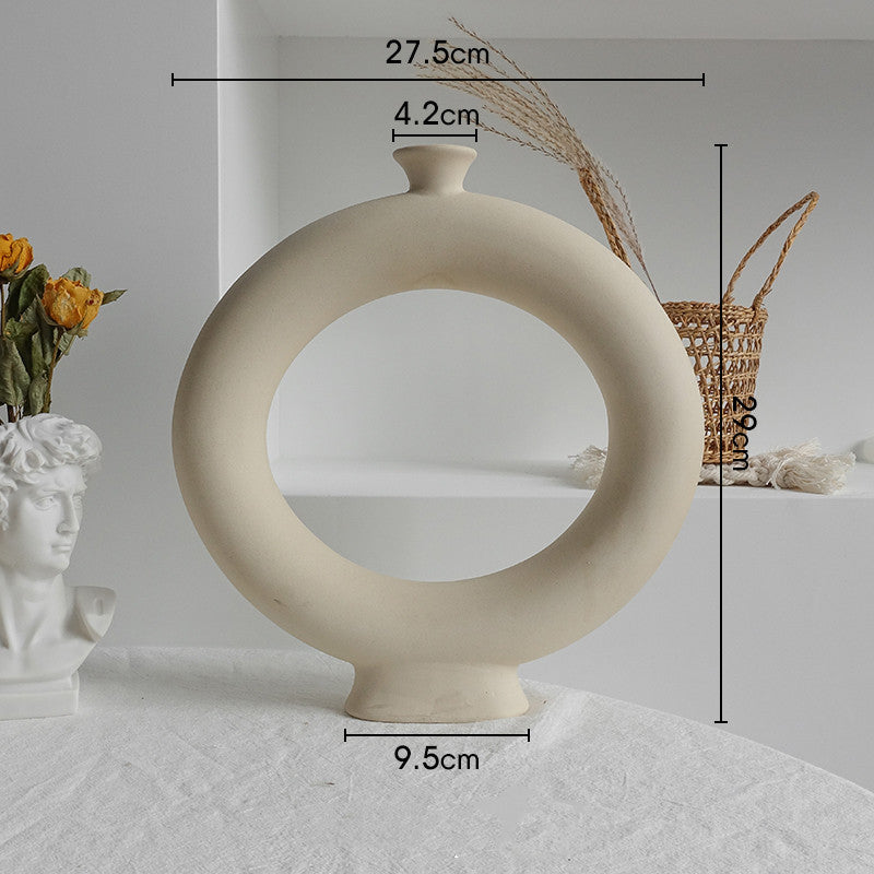 Nordic matte ceramic vase used as a dining table centerpiece with dried lavender arrangement
