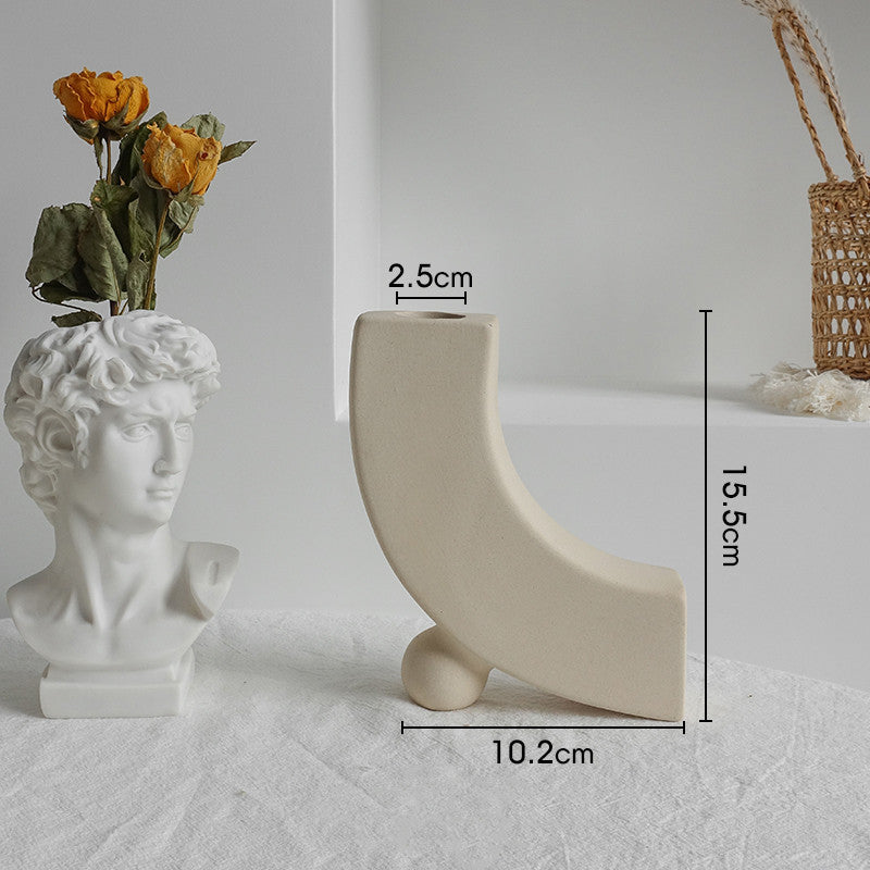 Multiple shape options of the matte ceramic vase displayed together on a neutral surface
