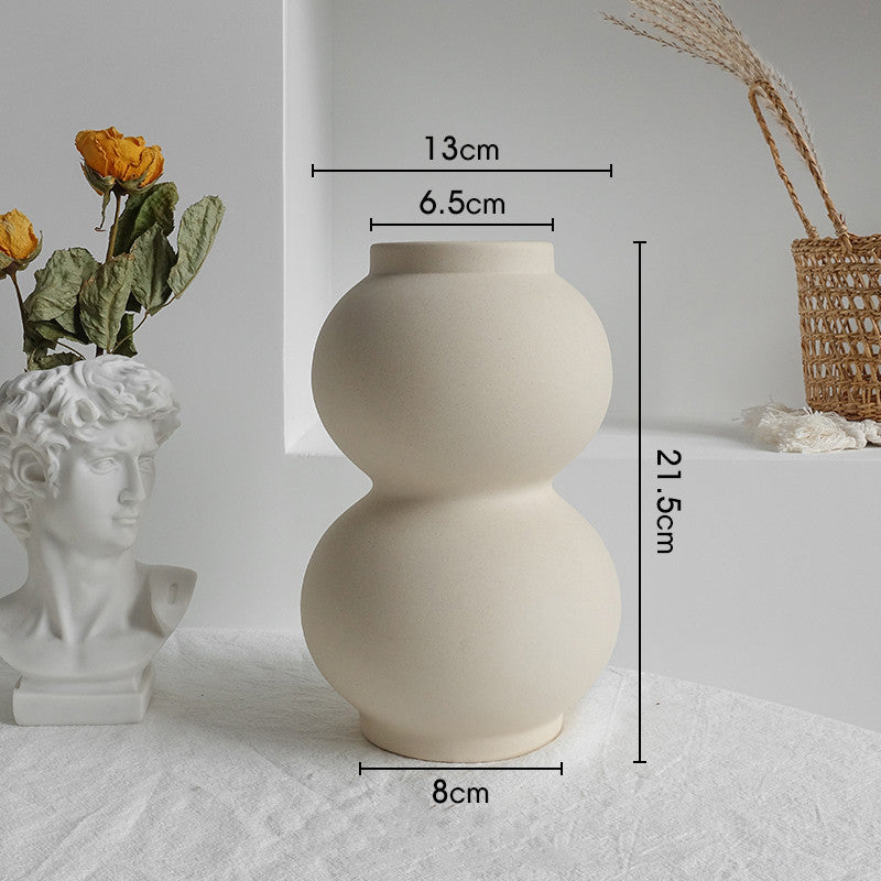Close-up of the smooth unglazed matte surface texture of the Nordic ceramic vase

