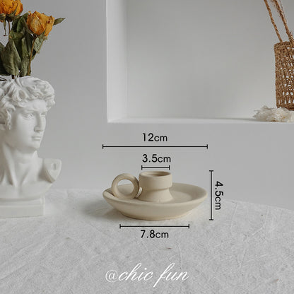 Two matte ceramic vases side by side showing natural tone and texture variation between pieces
