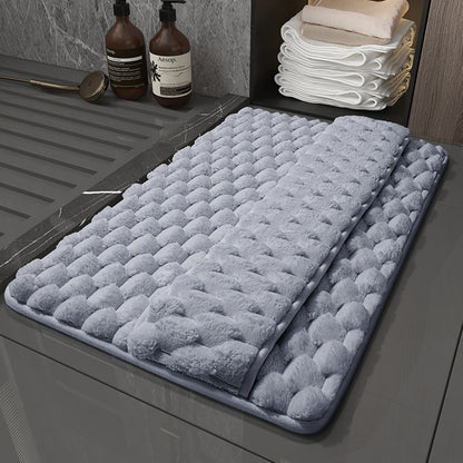 Small 40x60cm memory foam mat in front of a bathroom sink for size reference
