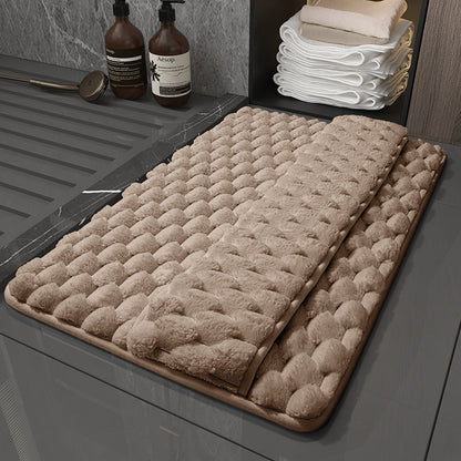 Large 60x90cm memory foam bathroom mat covering full area in front of a bathtub
