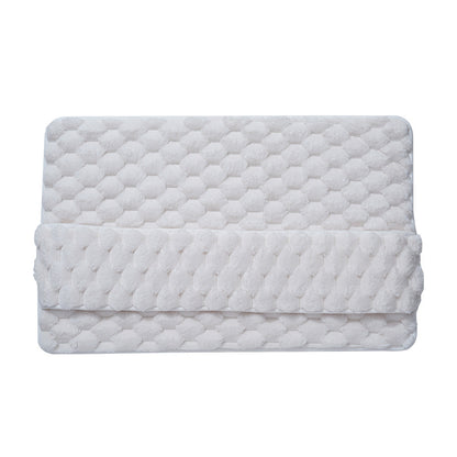 Foot pressing into the memory foam bathroom mat showing compression and cushion underfoot
