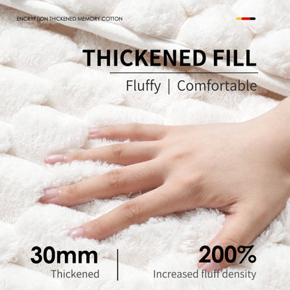 Mauve memory foam bath mat beside a bathtub in a modern bathroom
