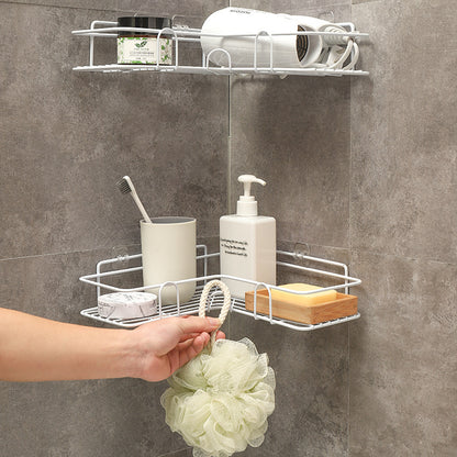 Hand installing metal corner shower caddy without drilling