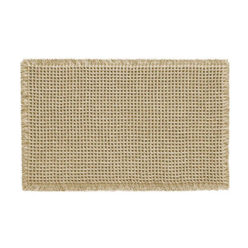 Hand touching soft microfiber absorbent bath mat showing comfort and quality