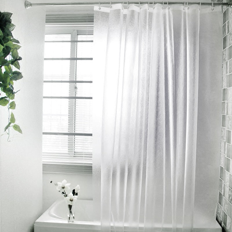 Waterproof mildew resistant PEVA shower curtain hanging on a bathroom rod over a bathtub

