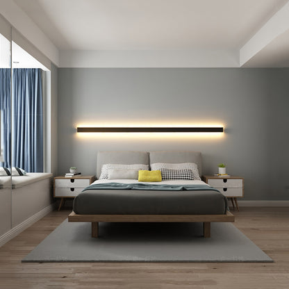 Minimalist LED wall lamp beside bed for ambient light