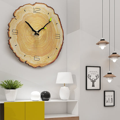 Minimalist Nordic ring wall clock mounted on a white living room wall above a sofa
