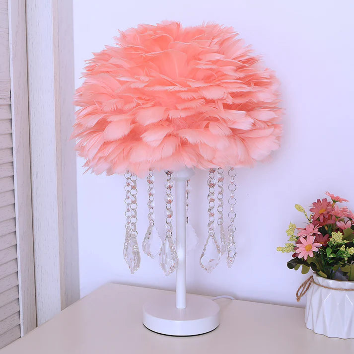 Modern feather decorative lamp with white feathers on a bedroom nightstand