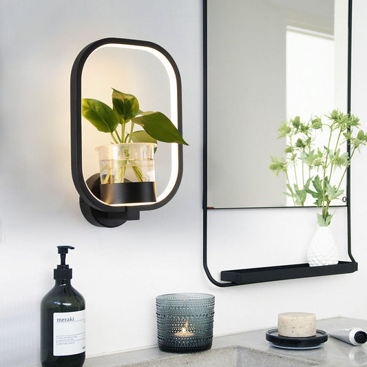 Modern LED wall lights in black iron finish with a small plant holder