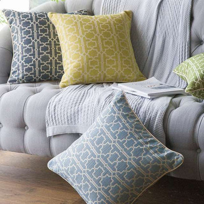 Blue Moroccan trellis throw pillow on sofa
