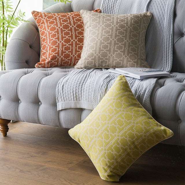 Orange Moroccan trellis throw pillow with geometric weave