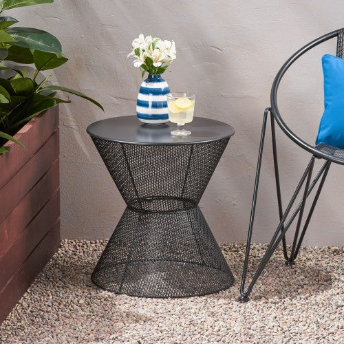 Nevada matte black iron side table on patio with outdoor chair