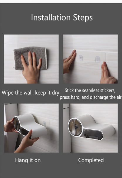 Self adhesive toilet roll holder mounted on a marble bathroom wall beside a toilet
