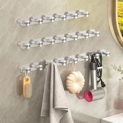 Winter coat hanging on a no drill stainless steel adhesive wall hook in a home entryway
