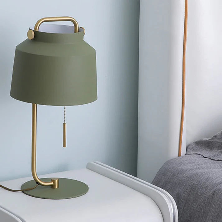 Side view of Nordic decorative lamp showing iron shade and gold base