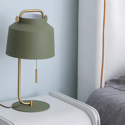 Side view of Nordic decorative lamp showing iron shade and gold base
