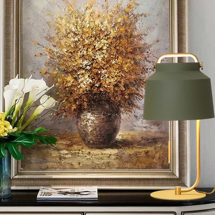 Green decorative lamp on study desk with books